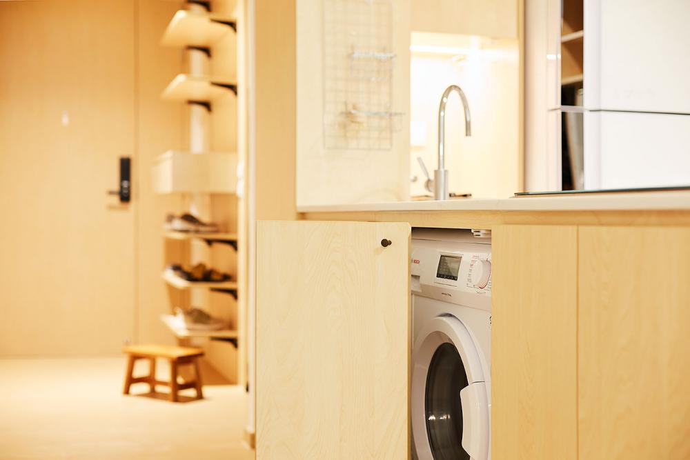 Minimalist Kitchen with Washing Machine and Kitchen Cabinets