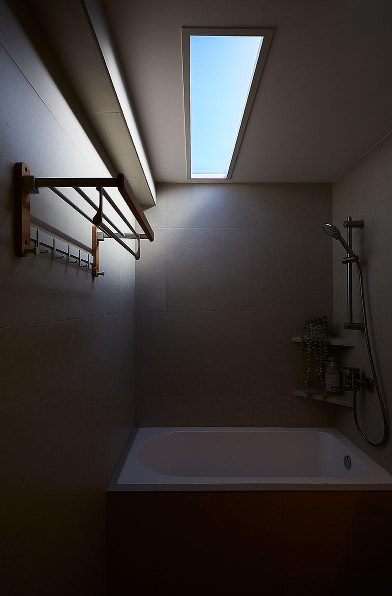 Scandinavian Bathroom with Bathtub and Lighting