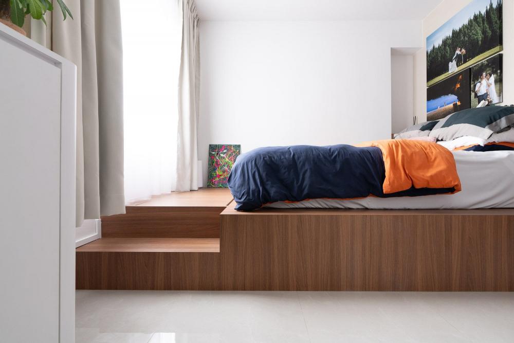 Modern Bedroom with Built-in Bed and Paintings