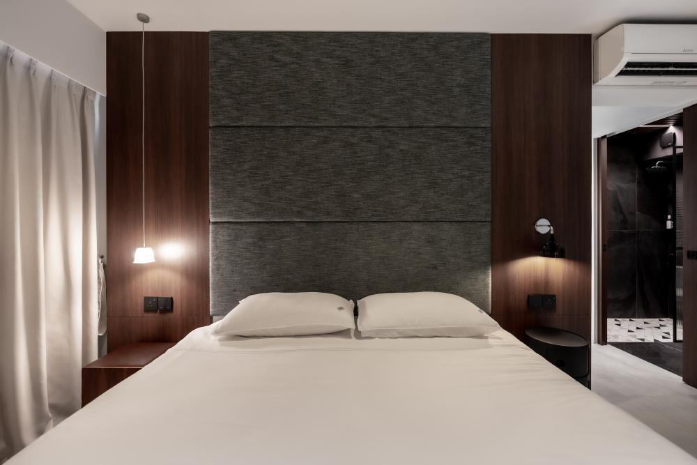 Minimalist Bedroom with Homogeneous Tiles and Drop Light