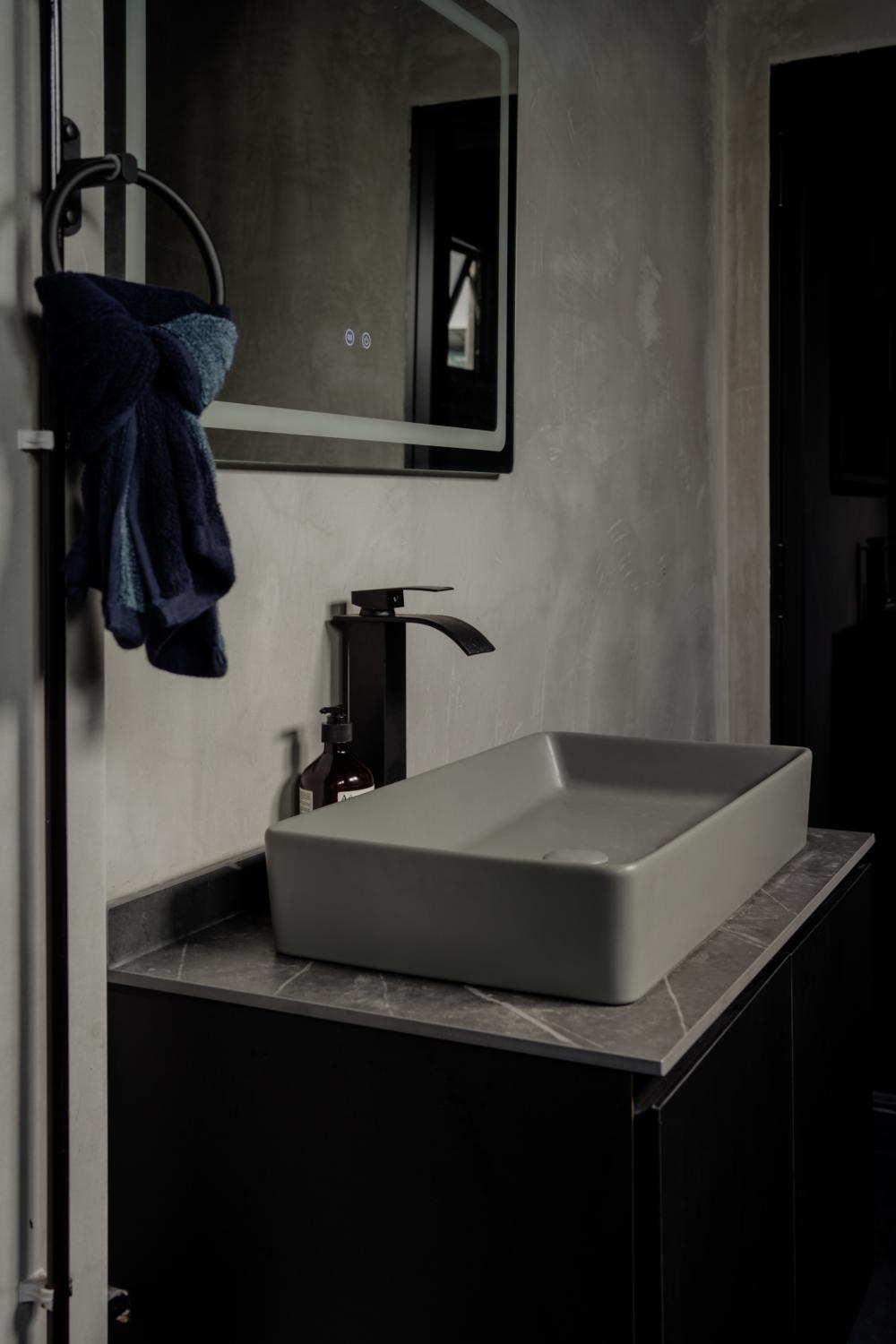 Industrial Bathroom with Herringbone Tiling and Parquet Floor