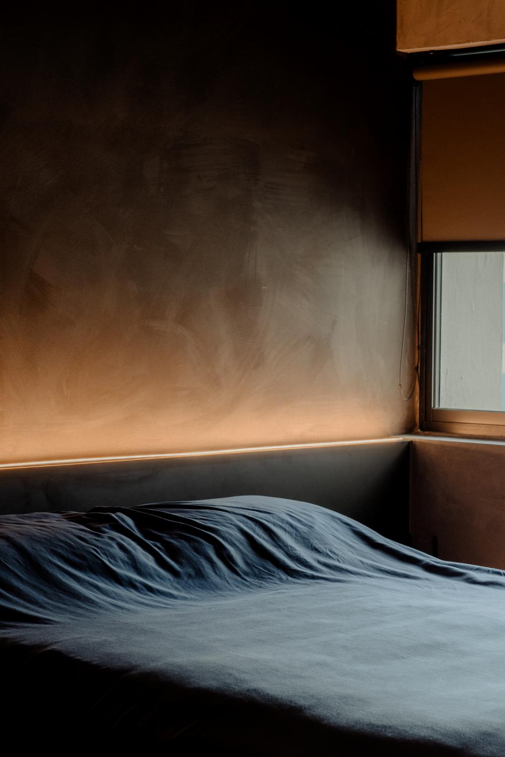 Industrial Bedroom with Cement Floor and Marble Floor