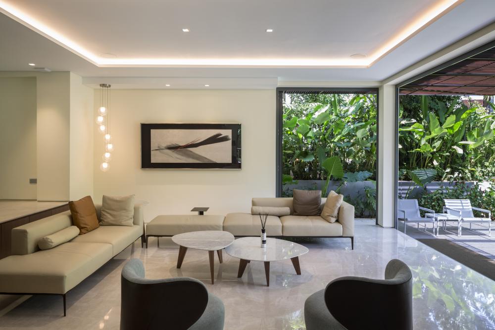 Contemporary Living Room with Marble Floor and Cove Lighting