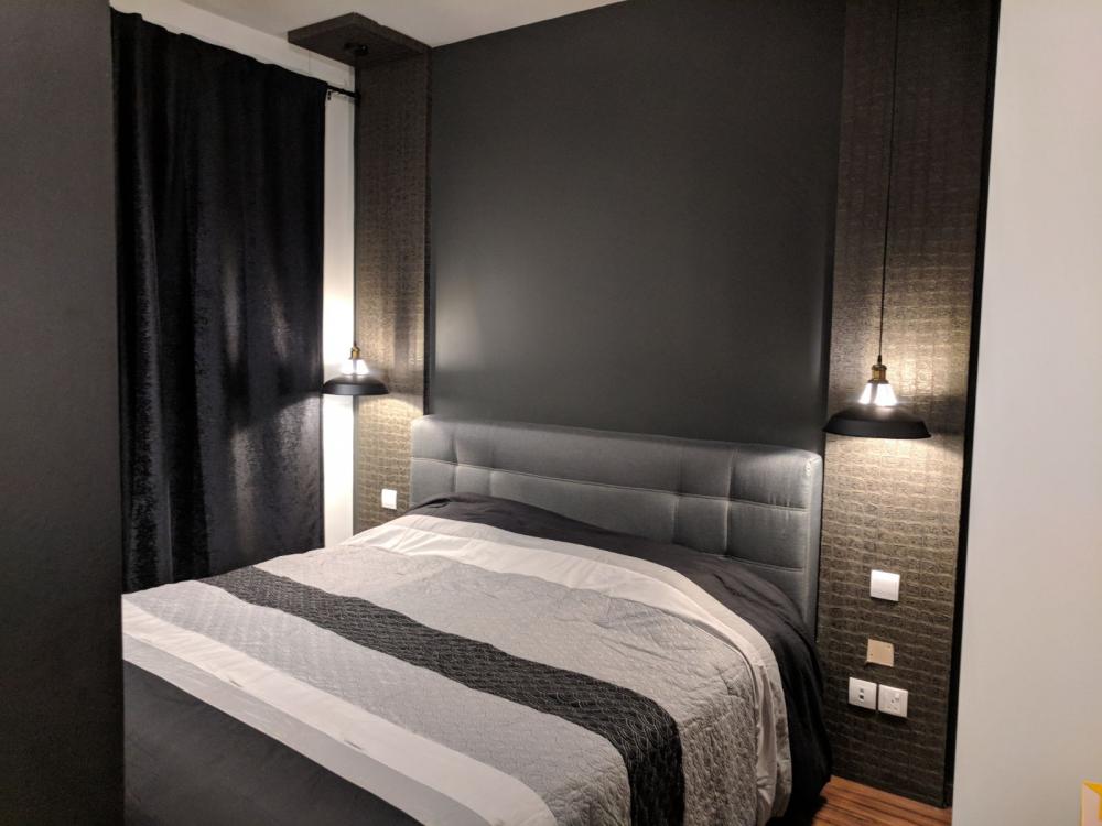 Minimalist Bedroom with Bed and Lighting