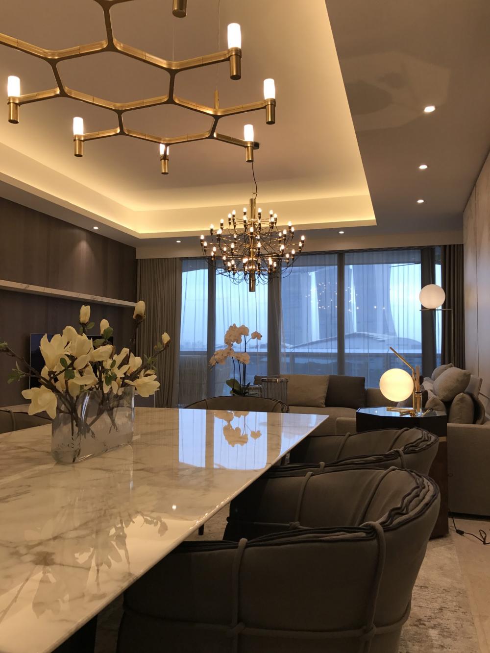 Modern Dining Room with Cove Lighting and Drop Ceiling