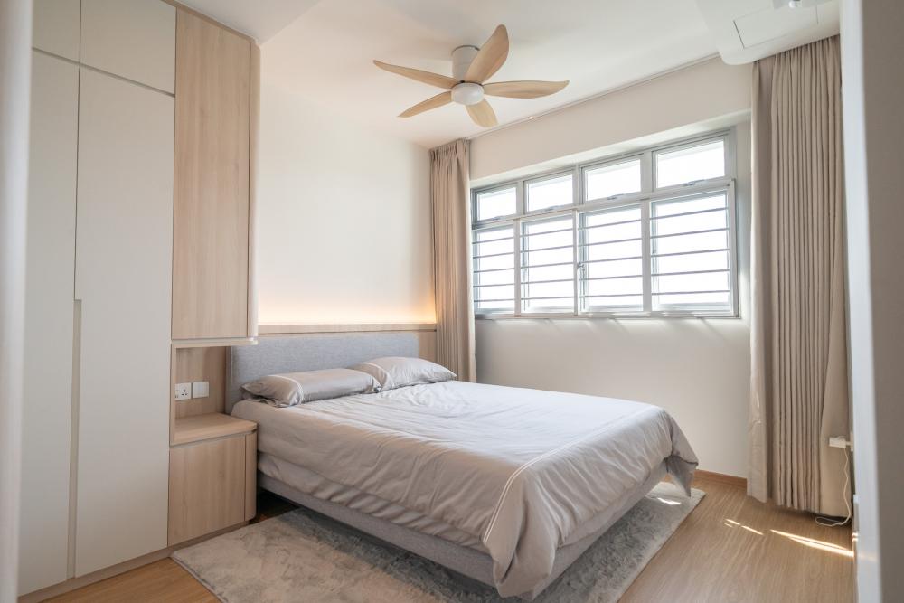 Minimalist Bedroom with Wood Flooring and Ceiling Light