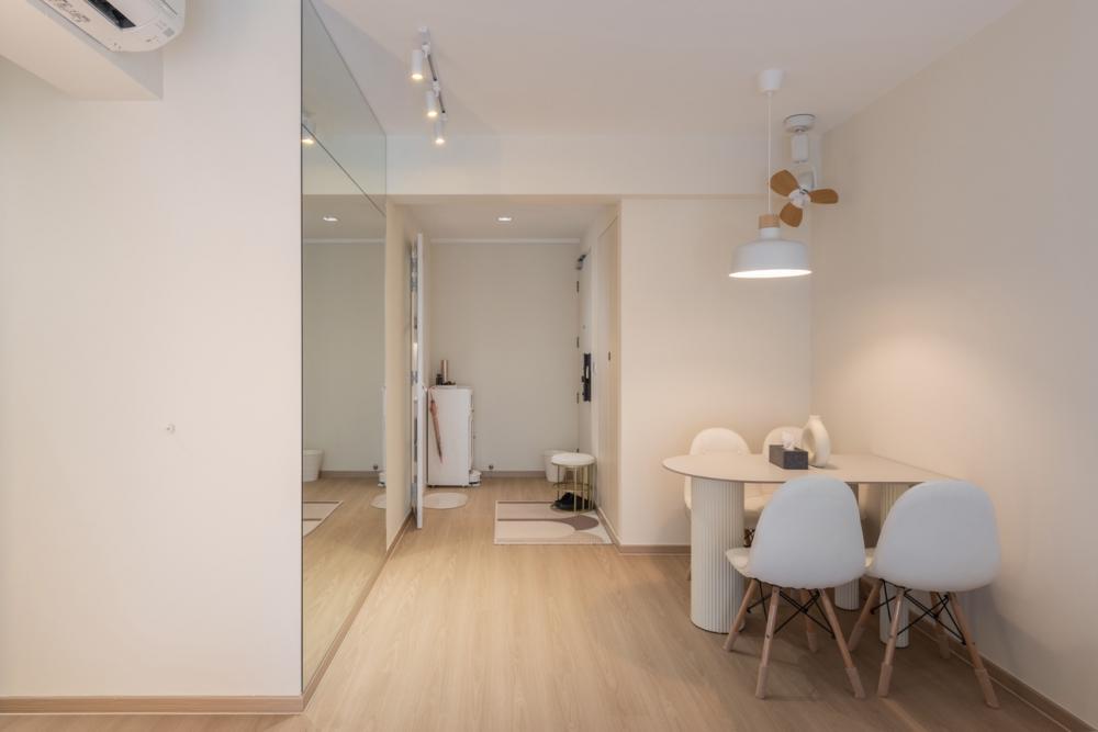 Minimalist Dining Room with Drop Light and Dining Table