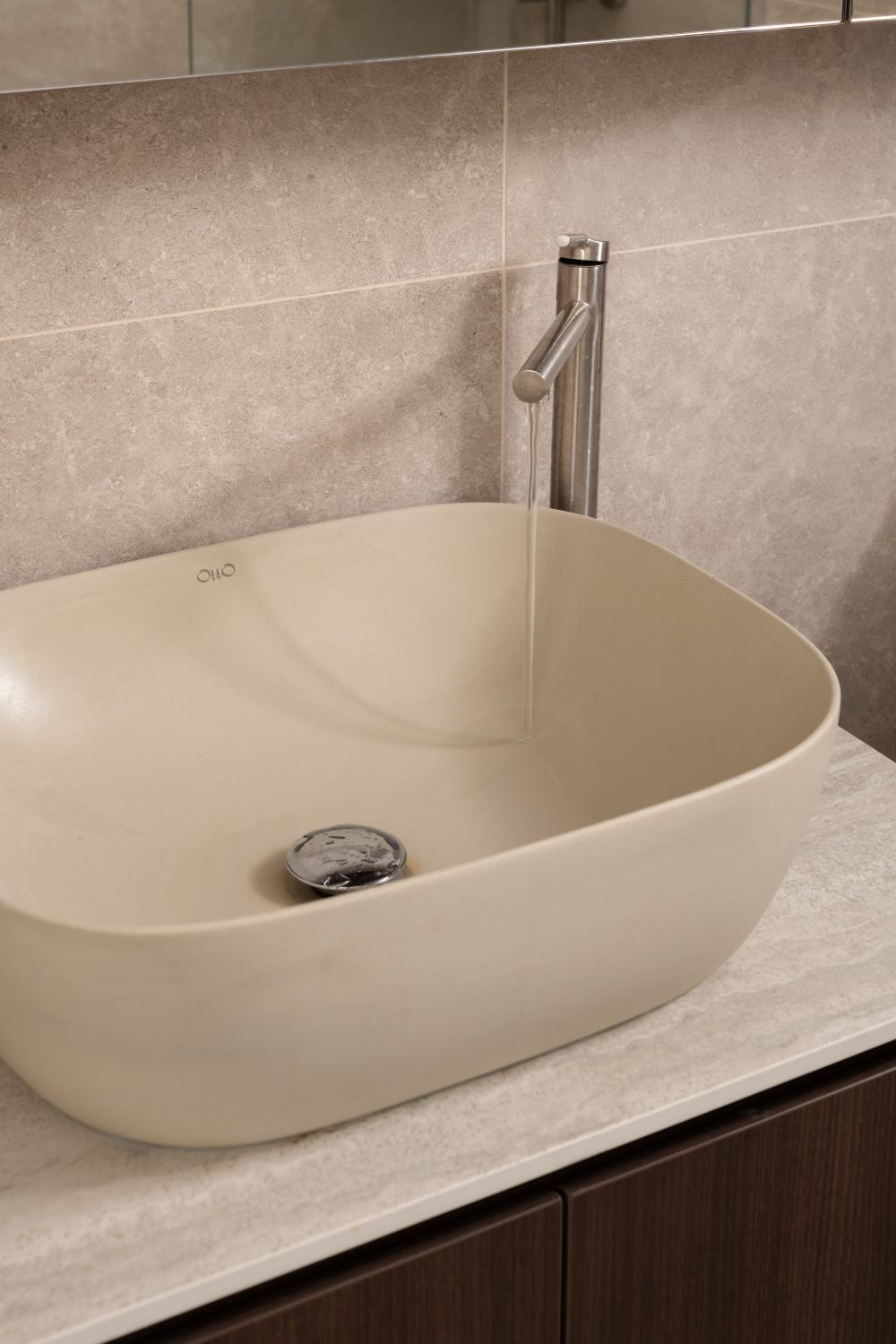 Minimalist Bathroom with Homogeneous Tiles and Bathroom Sinks