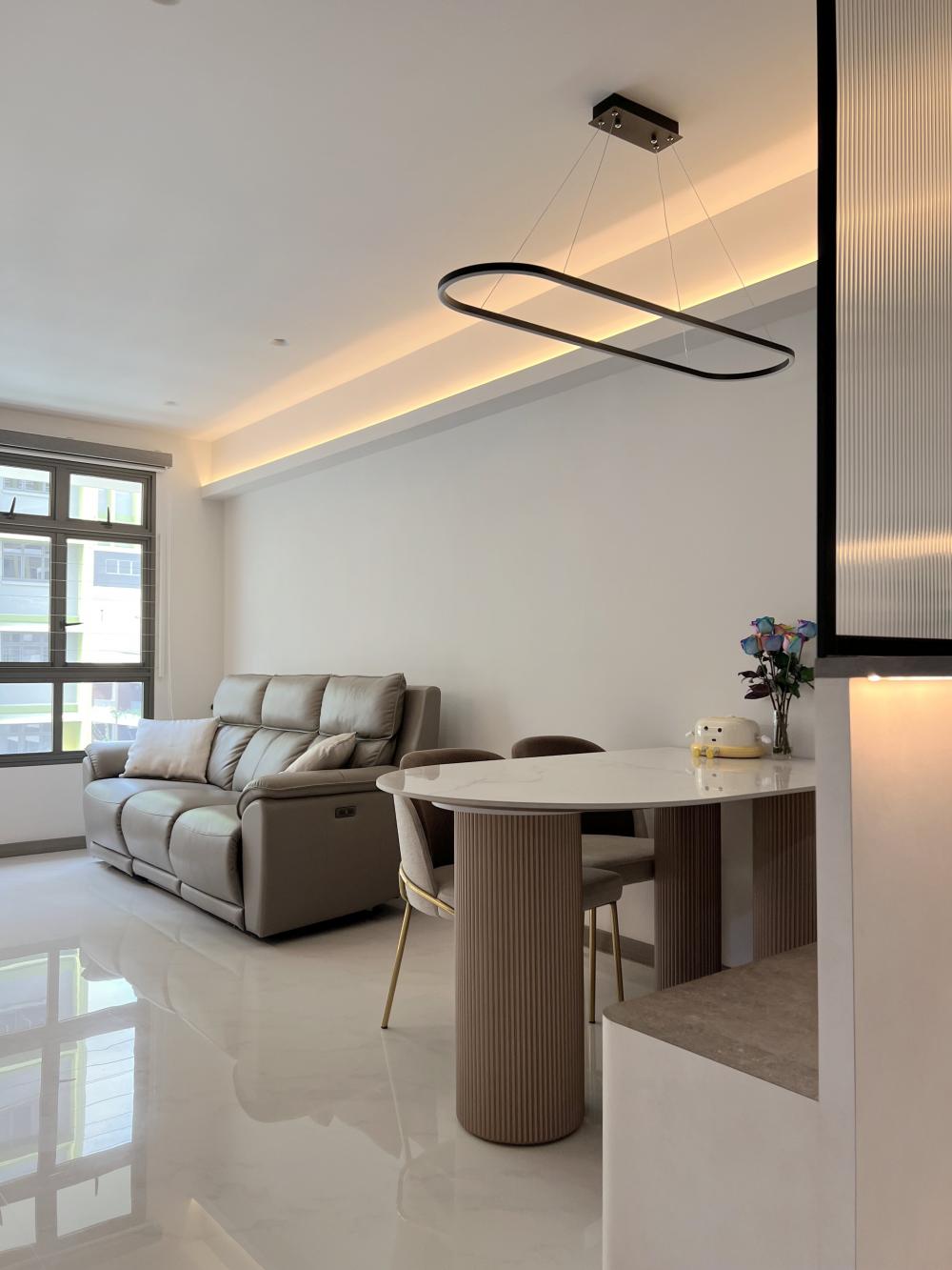Modern Living Room with Homogeneous Tiles and Drop Light