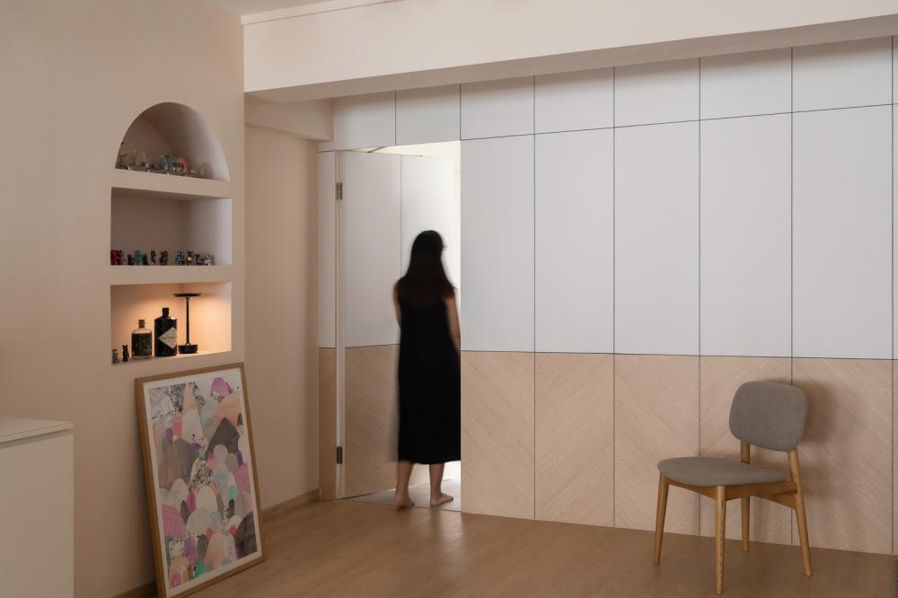 Scandinavian Hallway with Artwork and Dining Chairs