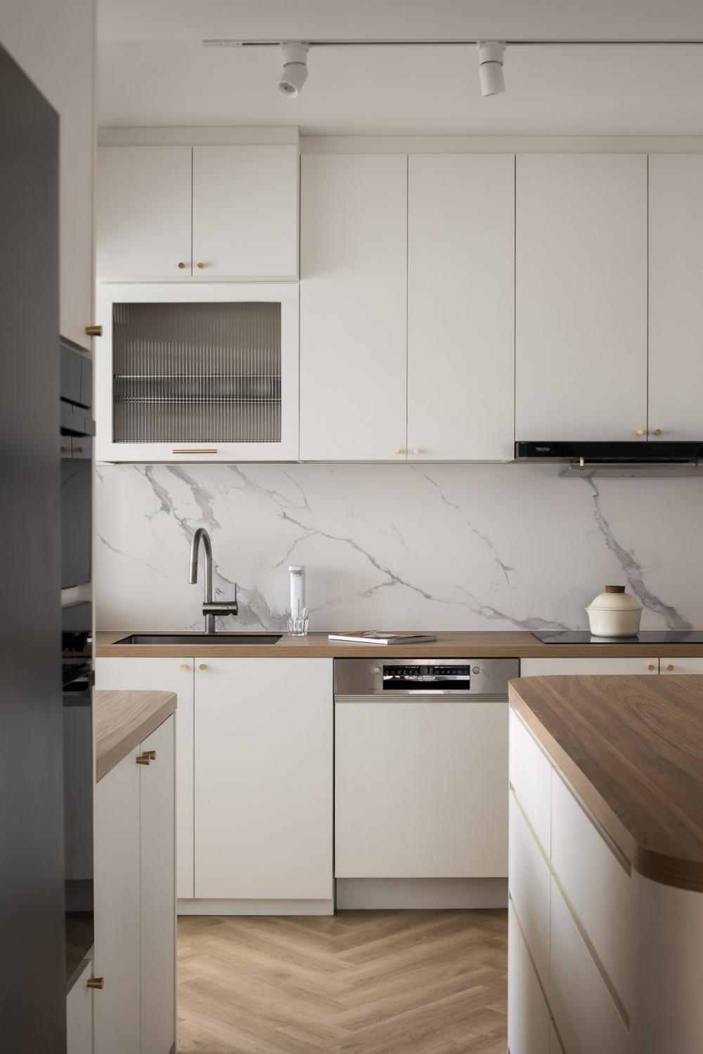 Scandinavian Kitchen with Herringbone Tiling and Cupboard