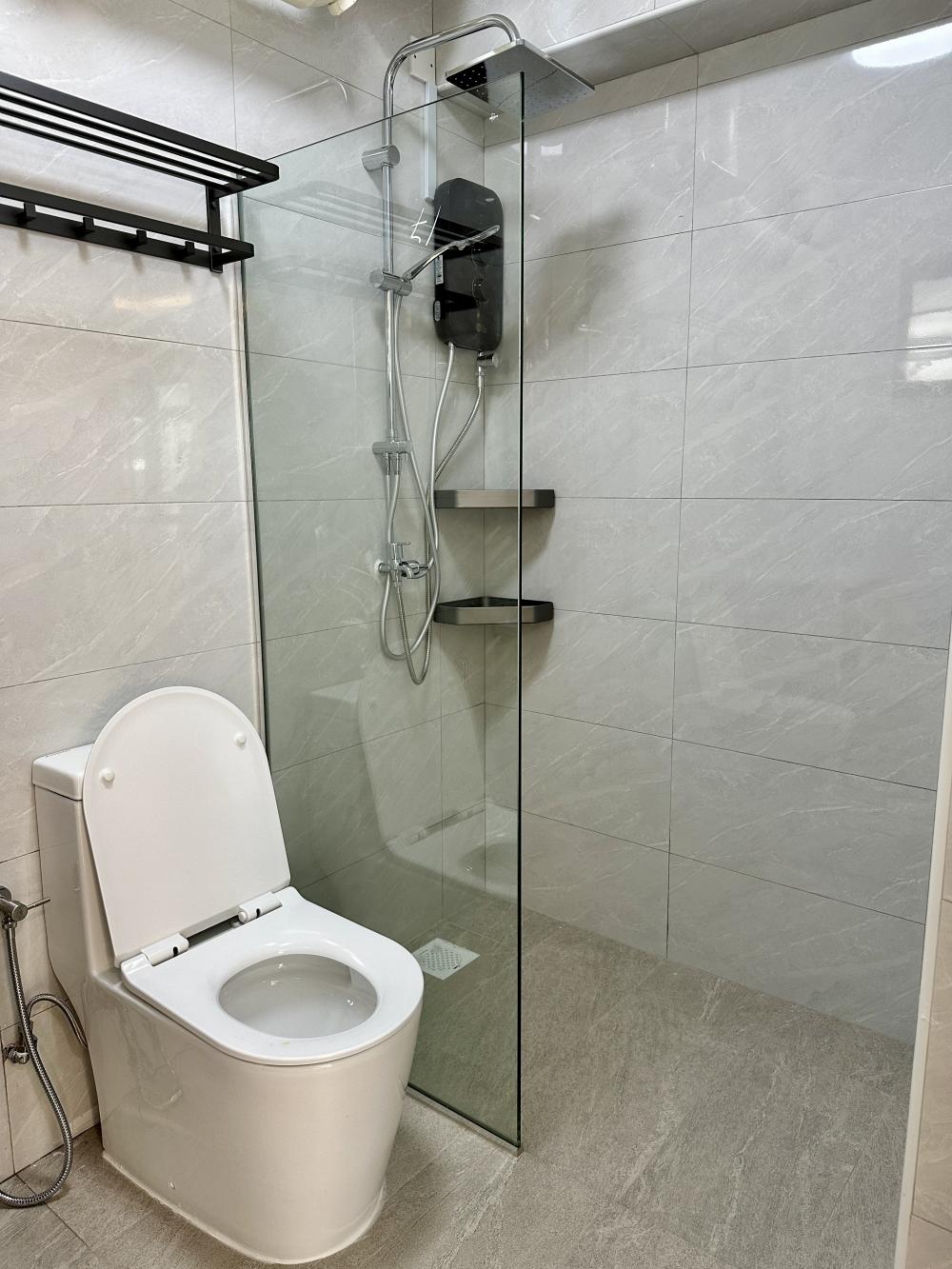Minimalist Bathroom with Shower Screen and Showers