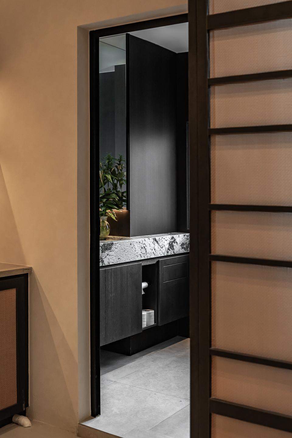 Asian Studio with Homogeneous Tiles and Feature Wall