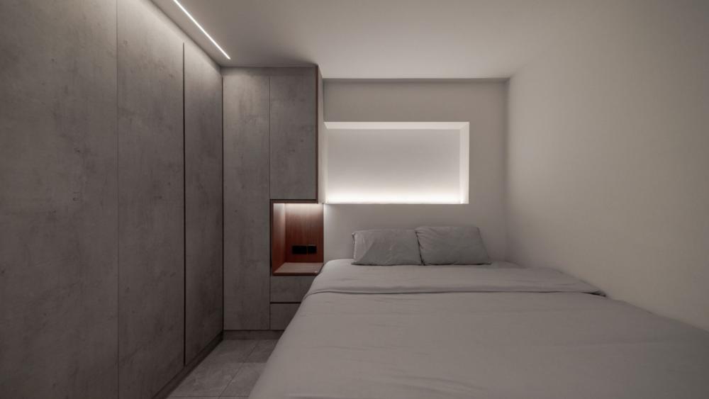 Modern Bedroom with Homogeneous Tiles and Cove Lighting