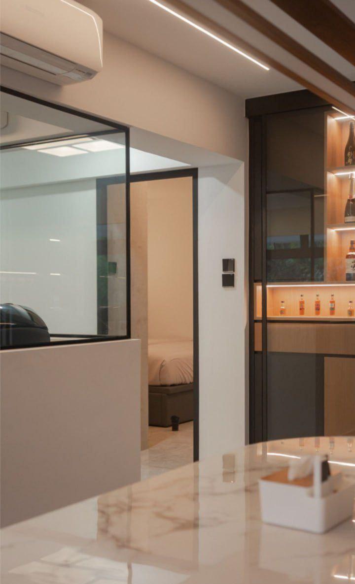 Modern Hallway with Cove Lighting and Glass Door