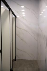 Minimalist Bathroom at Datwyler It Infra Pte. Ltd. / 30 Toh Guan Road #01-01A S608840