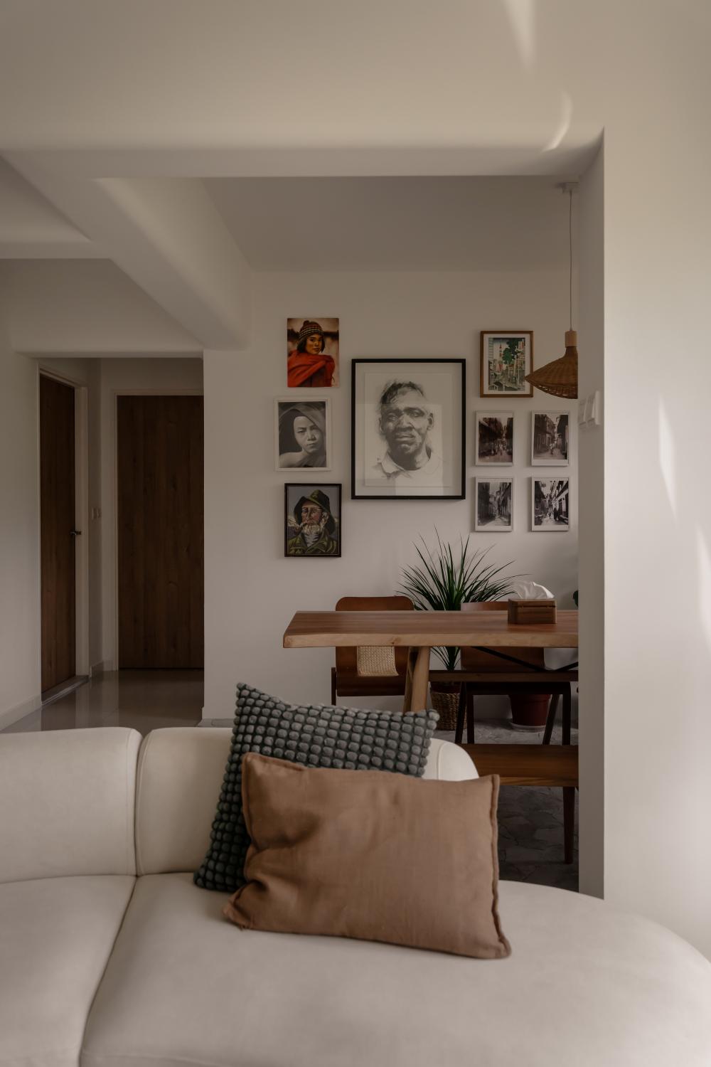 Scandinavian Dining Room with Drop Light and Artwork