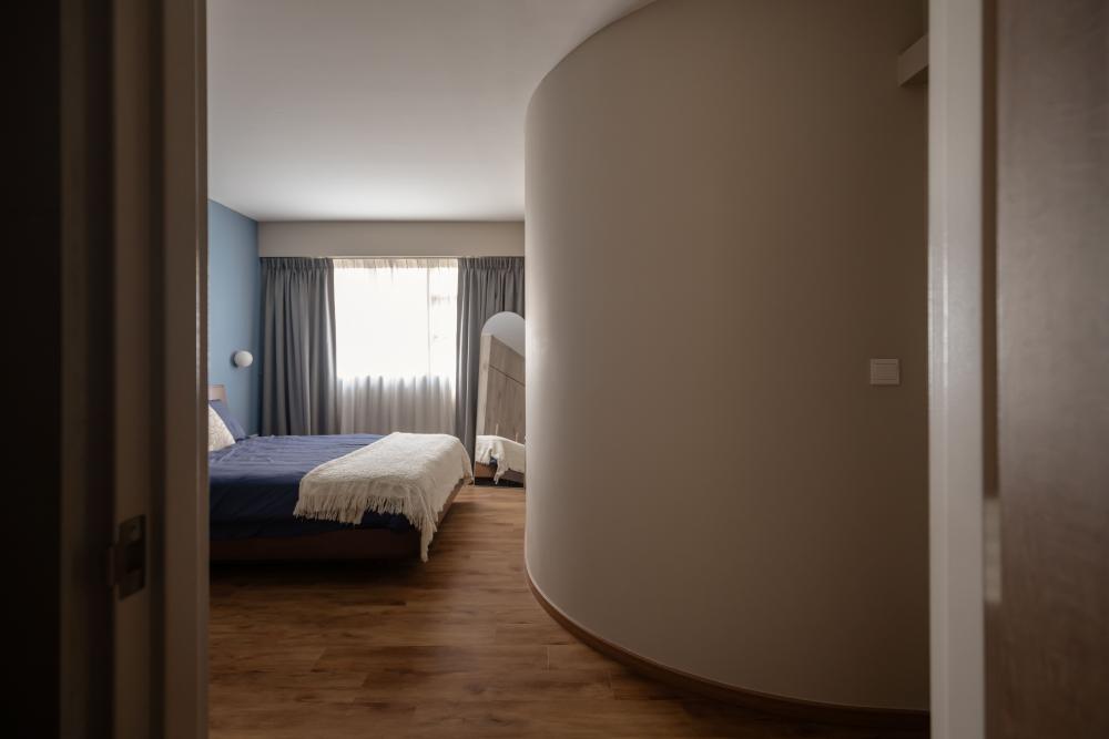 Scandinavian Bedroom with Mirror and Bed