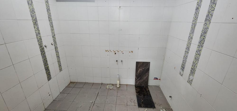 Modern Bathroom with Homogeneous Tiles and Bathroom Accessories