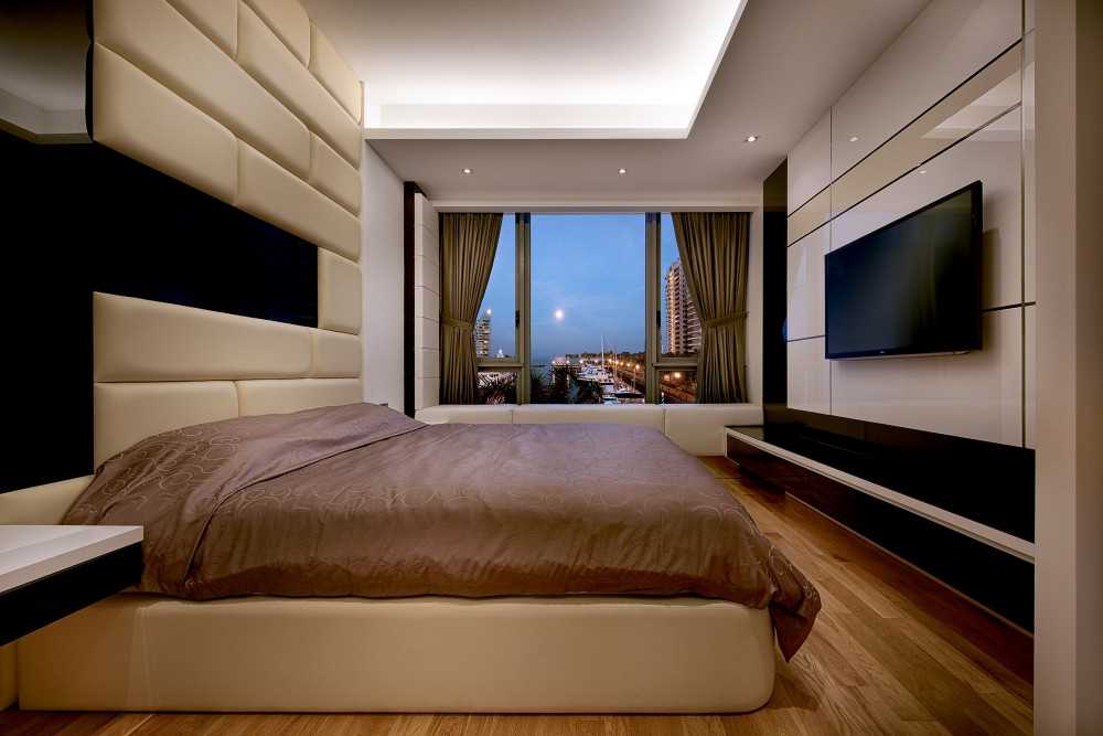 Modern Bedroom with TV and Bed