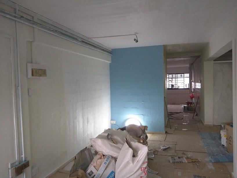 Asian Living Room with Homogeneous Tiles and Feature Wall