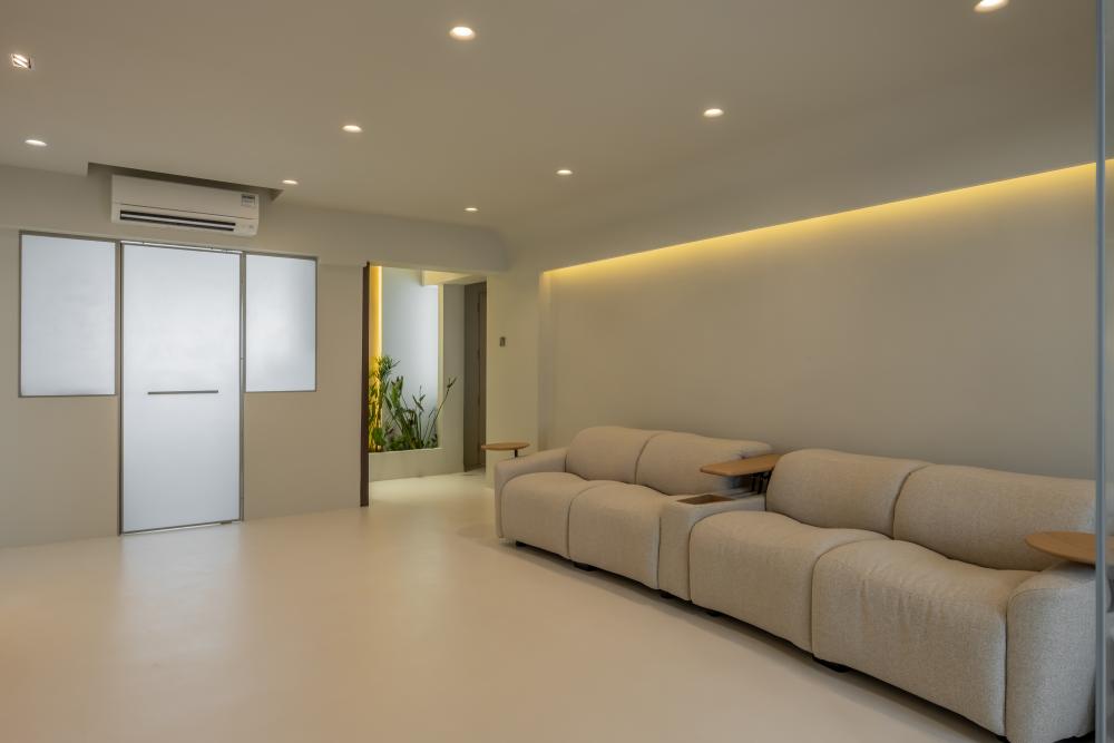 Minimalist Living Room with Cement Floor and Cove Lighting