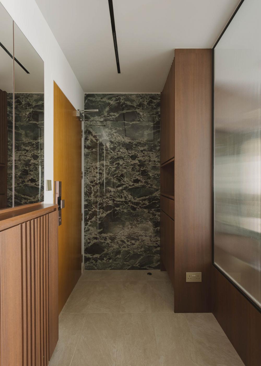 Modern Entryway with Homogeneous Tiles and Feature Wall
