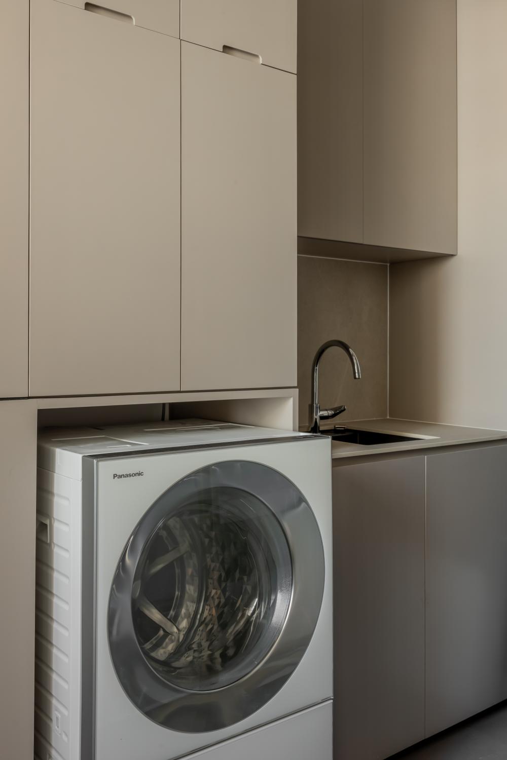 Minimalist Service Yard with Washing Machine and Laundry Area