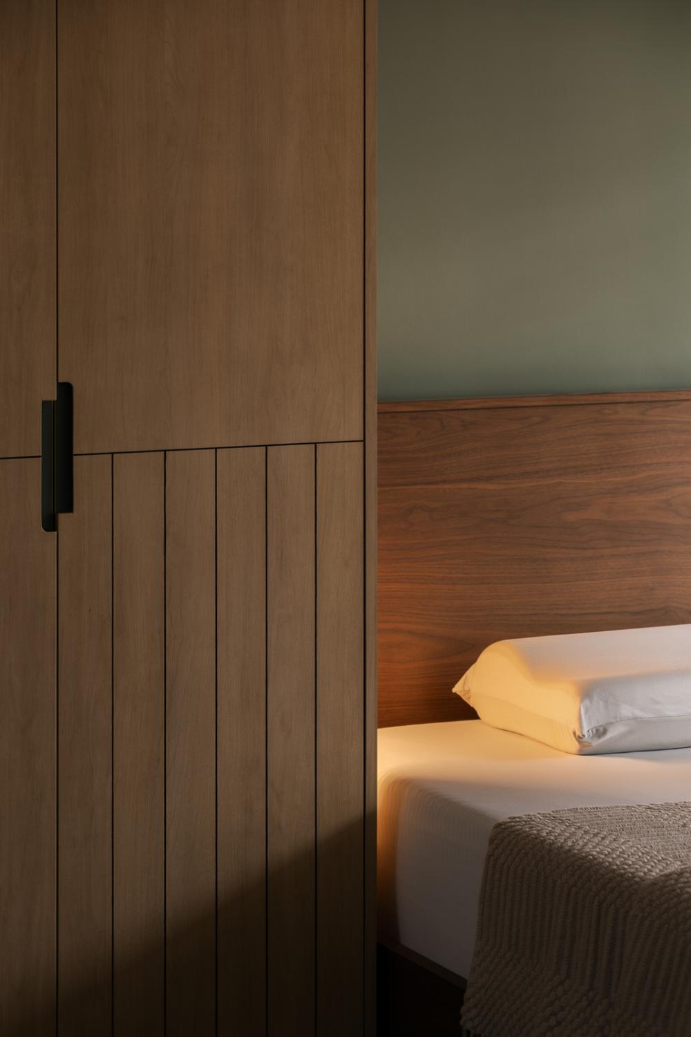 Transitional Bedroom with Wardrobe and Lighting