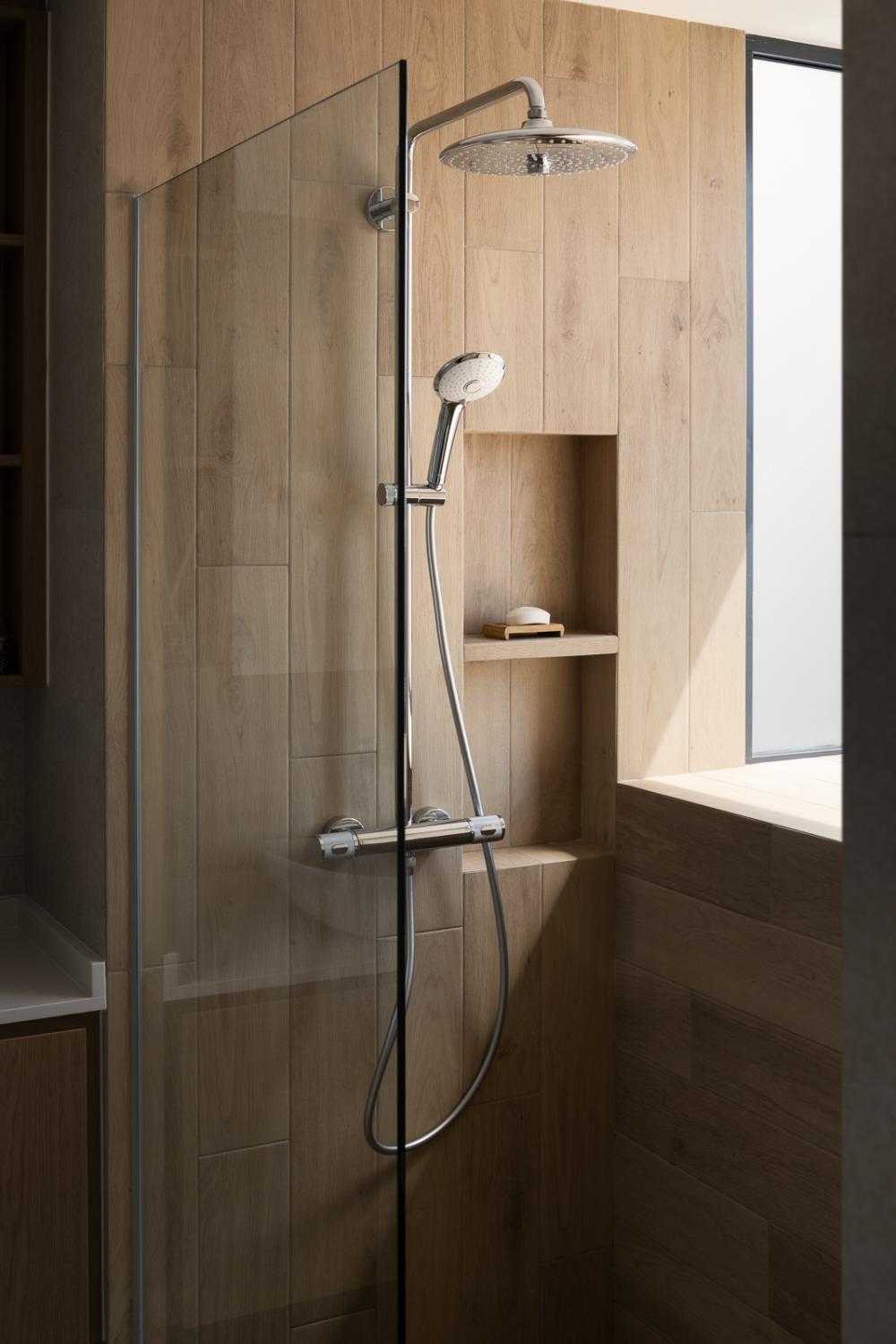 Asian Bathroom with Homogeneous Tiles and Shower Screen