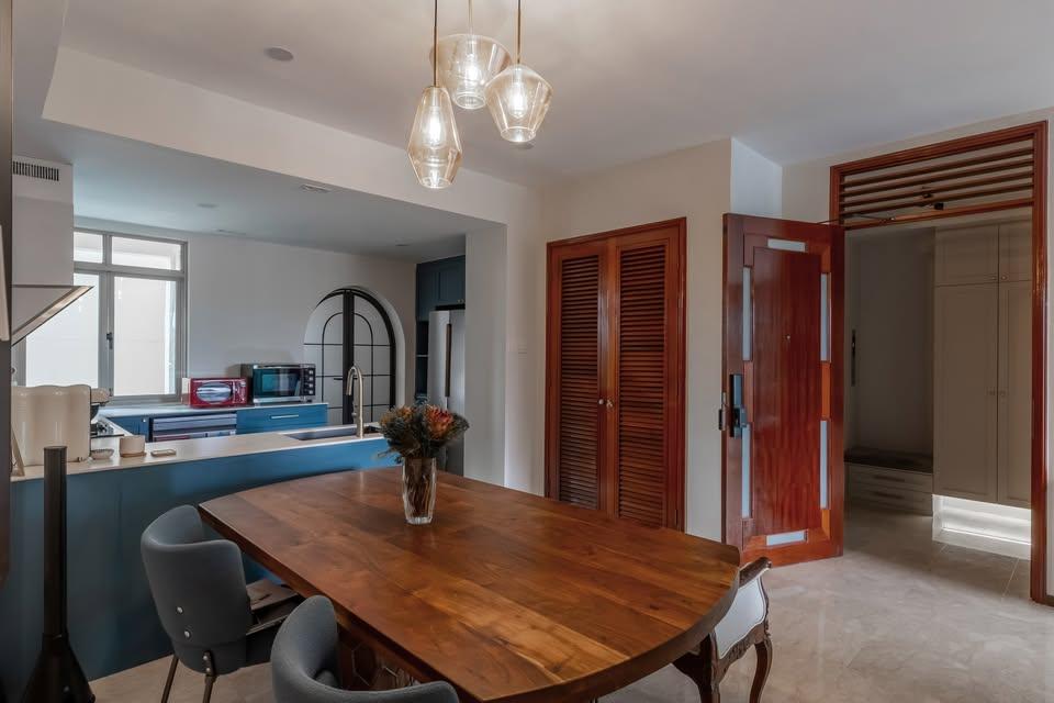 Eclectic Dining Room with Drop Light and Dining Table