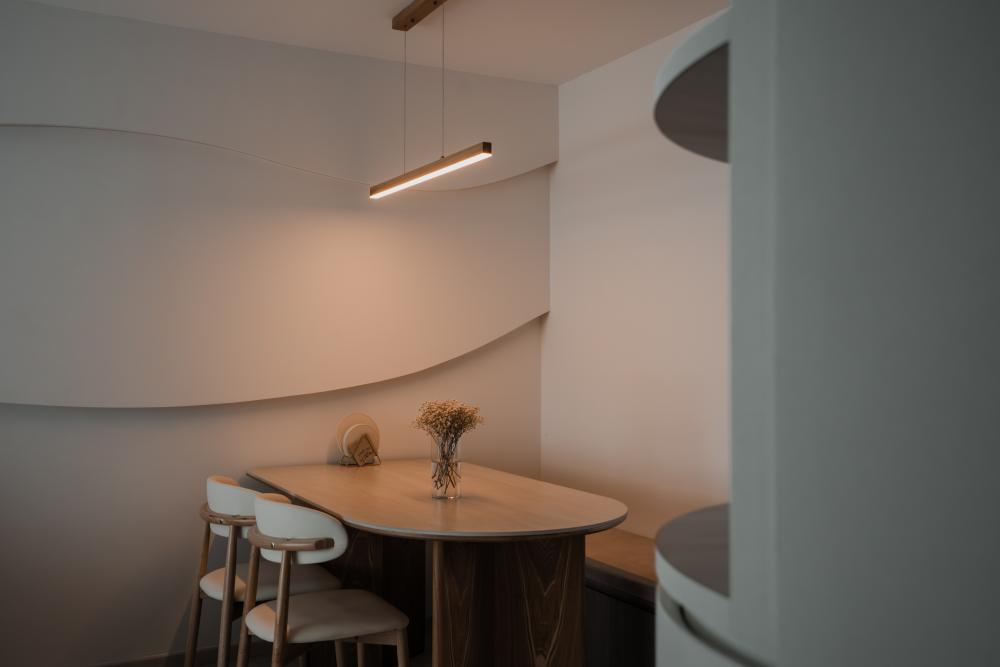 Contemporary Dining Room with Feature Wall and Drop Light