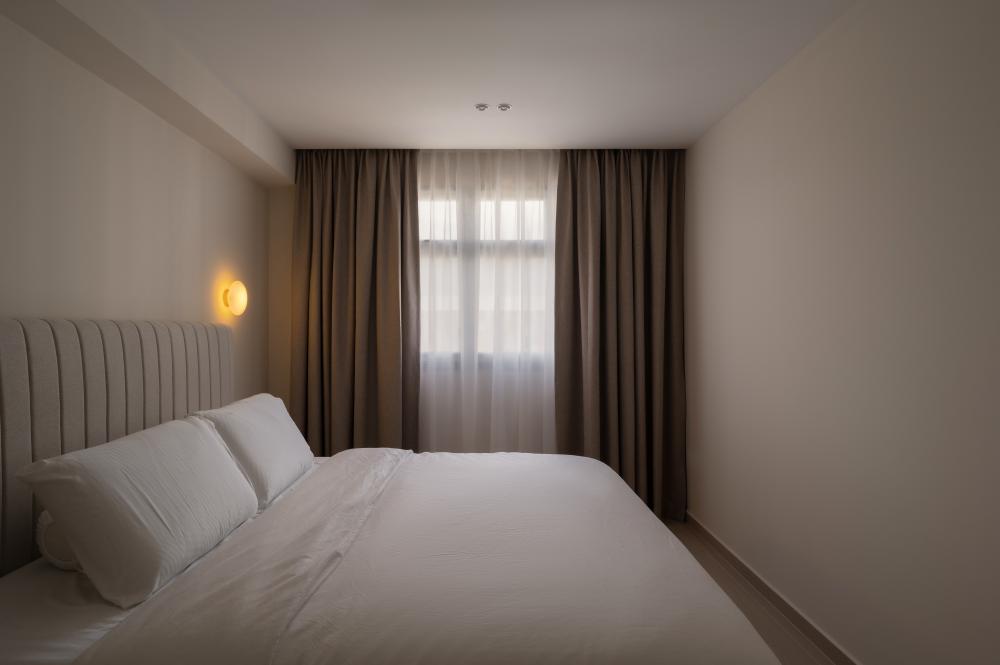 Contemporary Bedroom with Homogeneous Tiles and Lighting