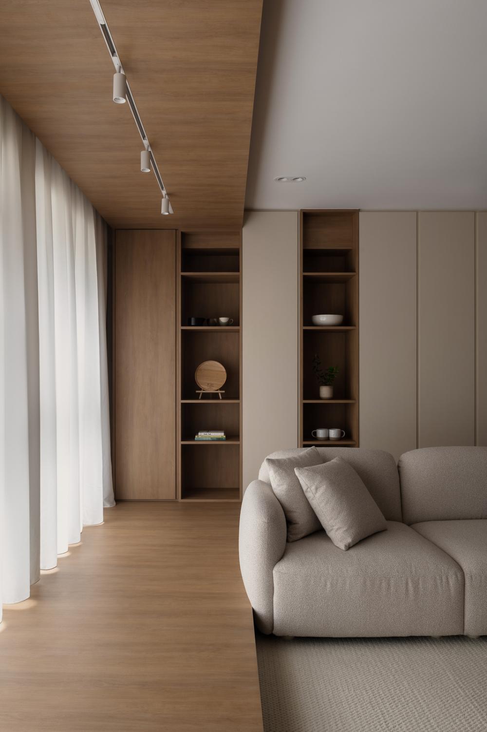 Asian Living Room with Bookshelf and Wood Flooring