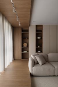 Asian Living Room at A Japandi-style HDB flat with curves