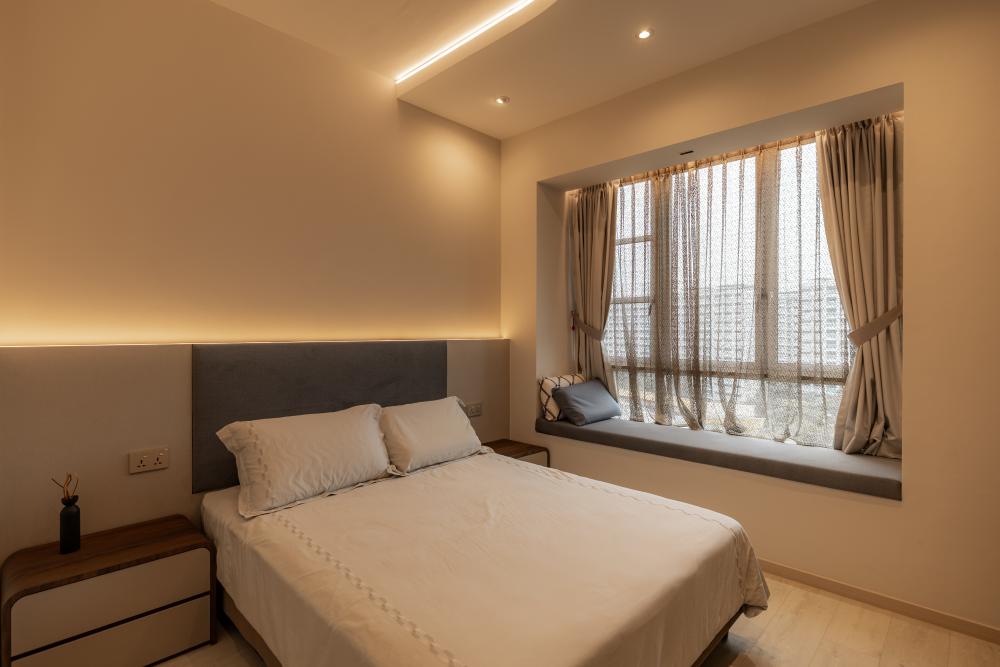 Modern Bedroom with Cove Lighting and Bedside Table