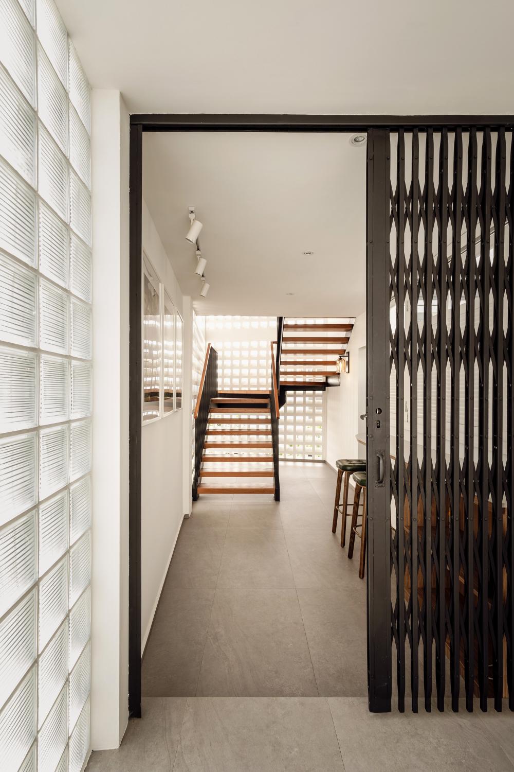 Vintage Hallway with Homogeneous Tiles and Feature Wall