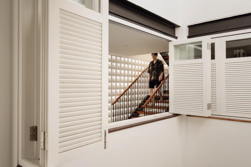 Vintage Hallway with Wood Flooring and Staircase