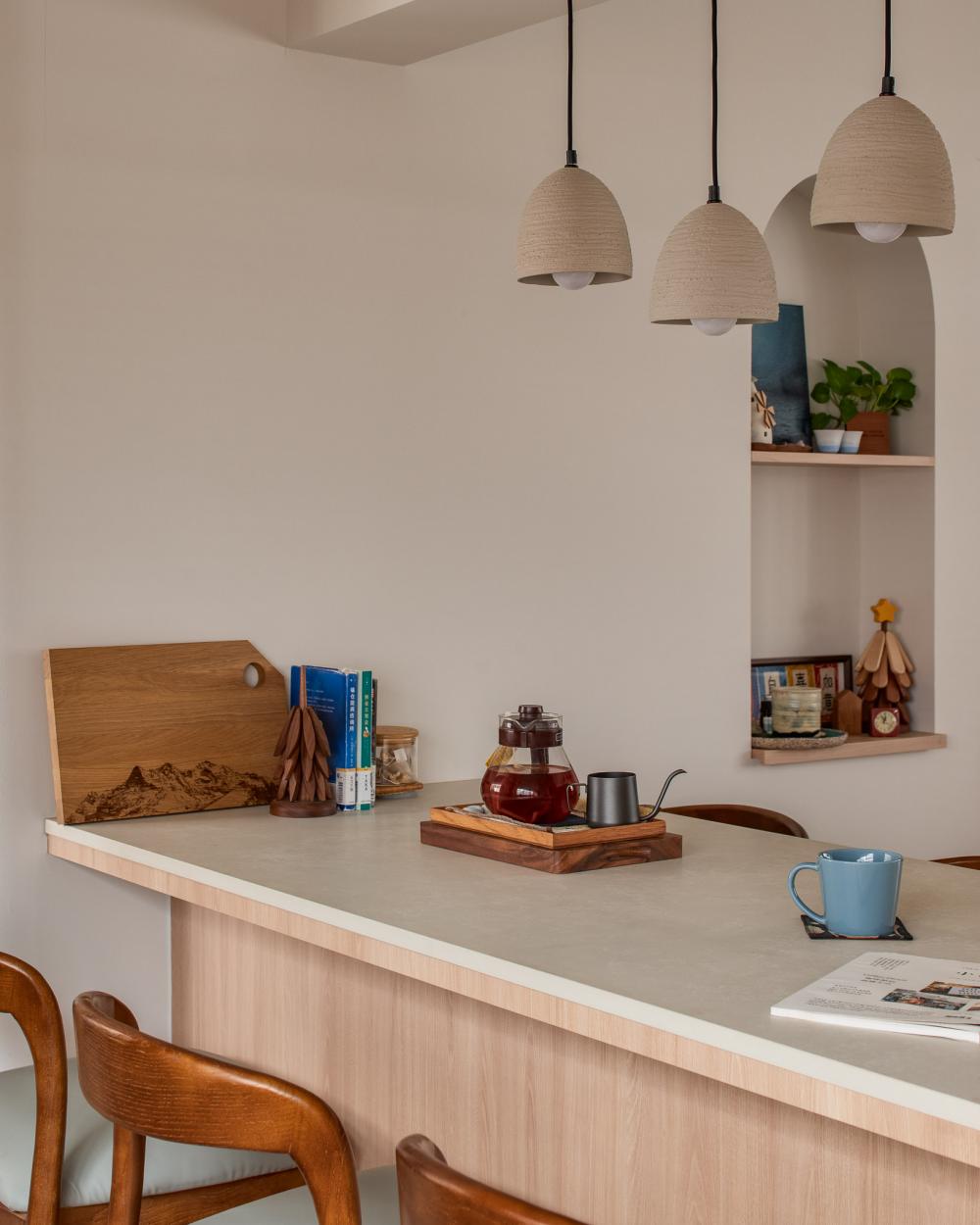 Minimalist Dining Room with Feature Wall and Drop Light