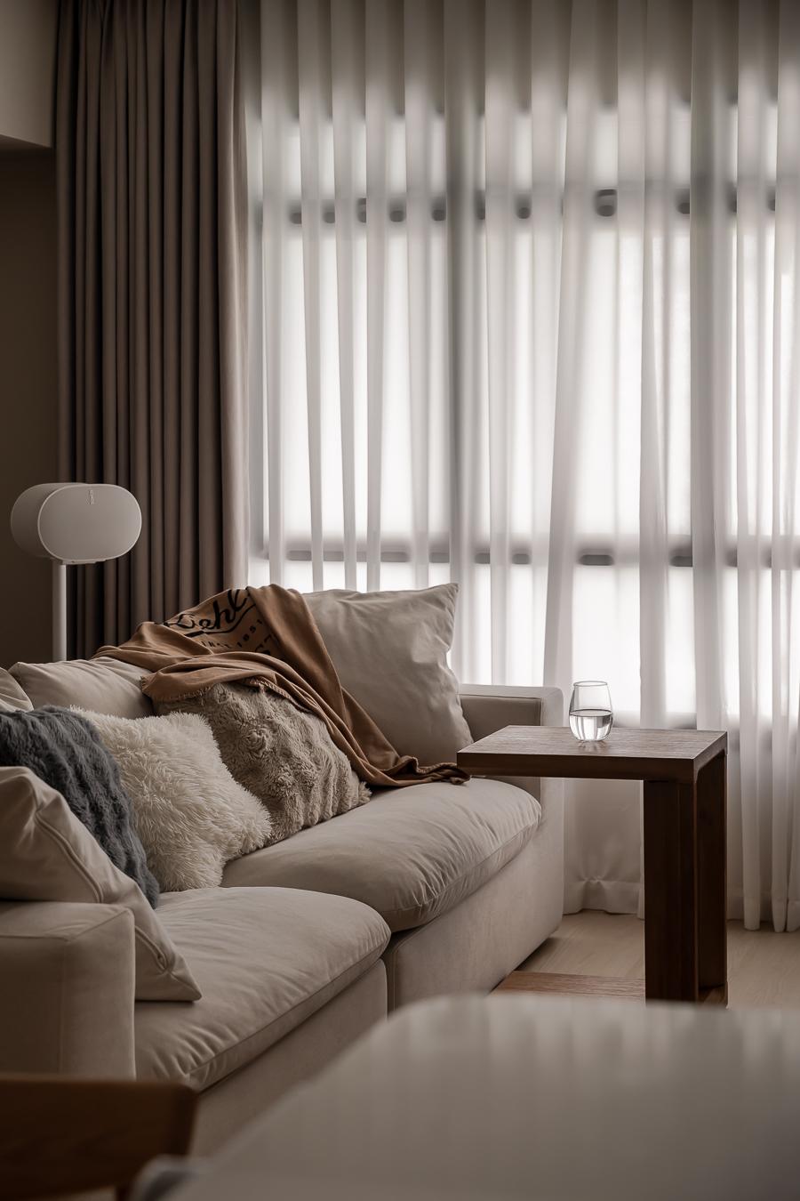 Scandinavian Living Room with Sofa and Paintings