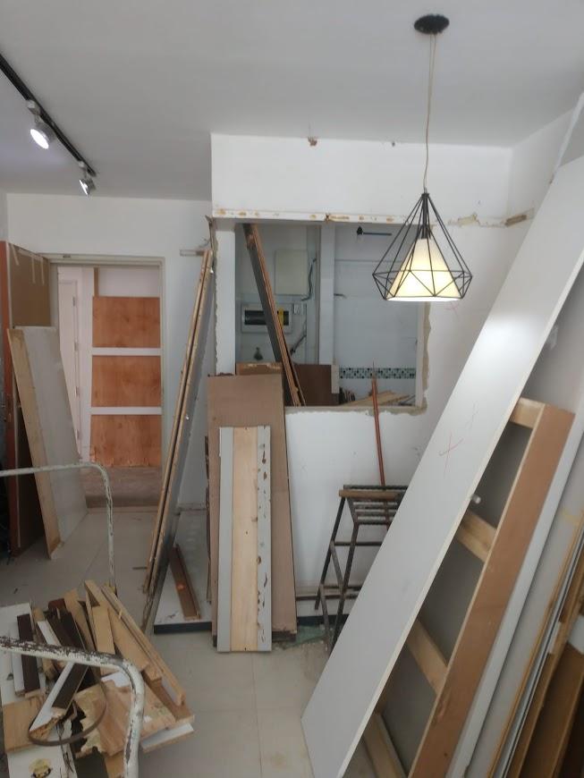 Asian Living Room with Feature Wall and Display Cabinets