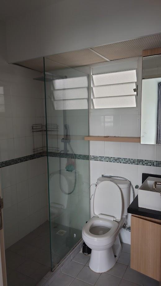 Asian Bathroom with Homogeneous Tiles and Mirror