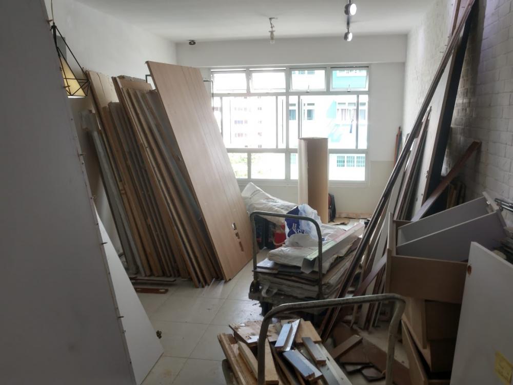 Asian Living Room with Homogeneous Tiles and TV Console