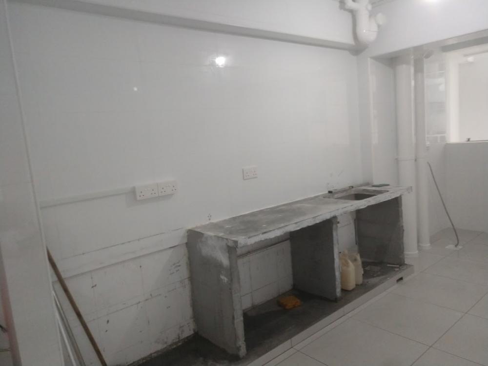 Asian Kitchen with Kitchen Island and Cupboard