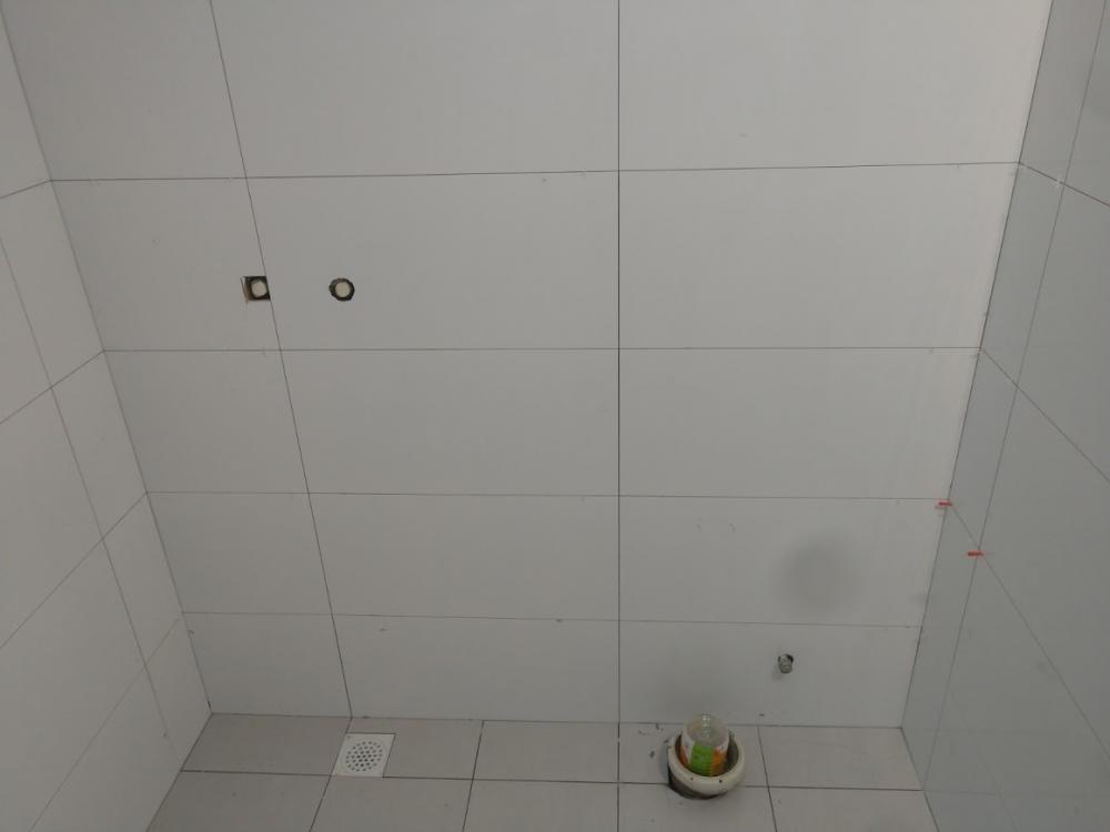 Asian Bathroom with Homogeneous Tiles and Cement Floor