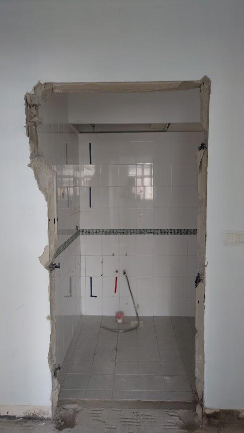 Asian Bathroom with Homogeneous Tiles and Mirror