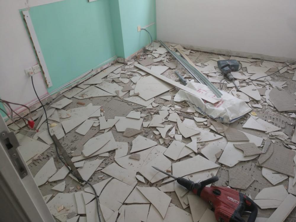 Asian Bedroom with Homogeneous Tiles and Bedside Table