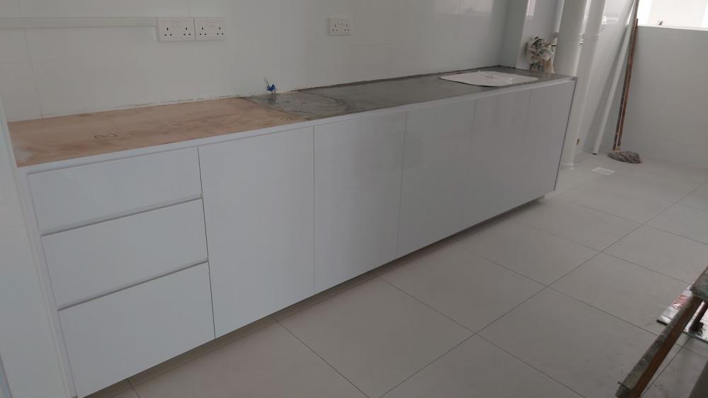 Asian Kitchen with Homogeneous Tiles and Wood Flooring