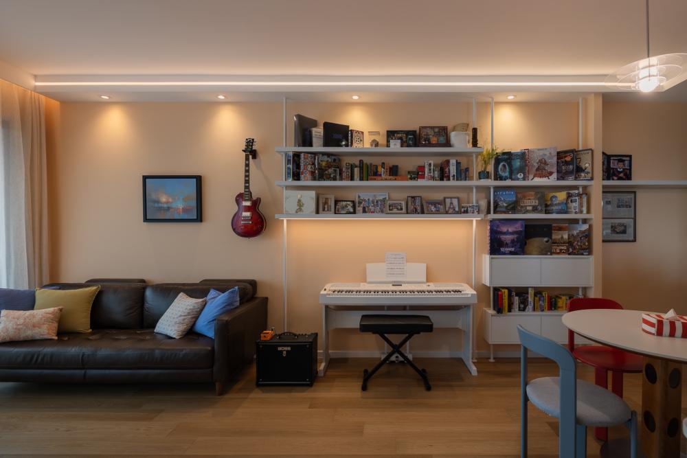 Eclectic Living Room with Bookshelf and Downlights