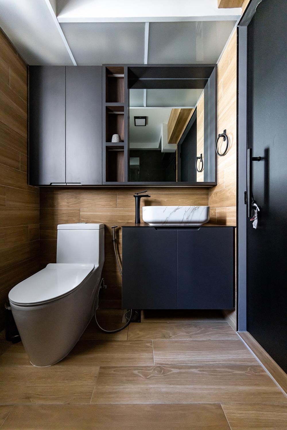 Industrial Bathroom with Homogeneous Tiles and Mirror